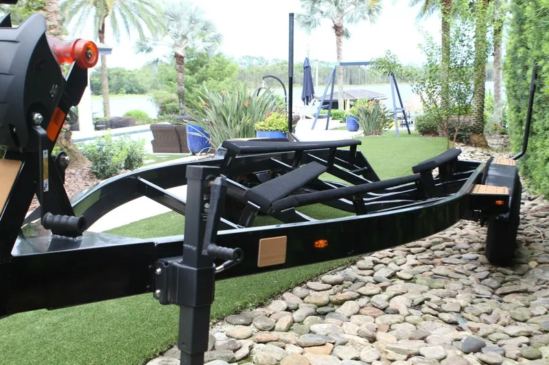  Yacht Photos Pics Trailer for 2024 Nautique Super Air Nautique G23 on a landscaped driveway.