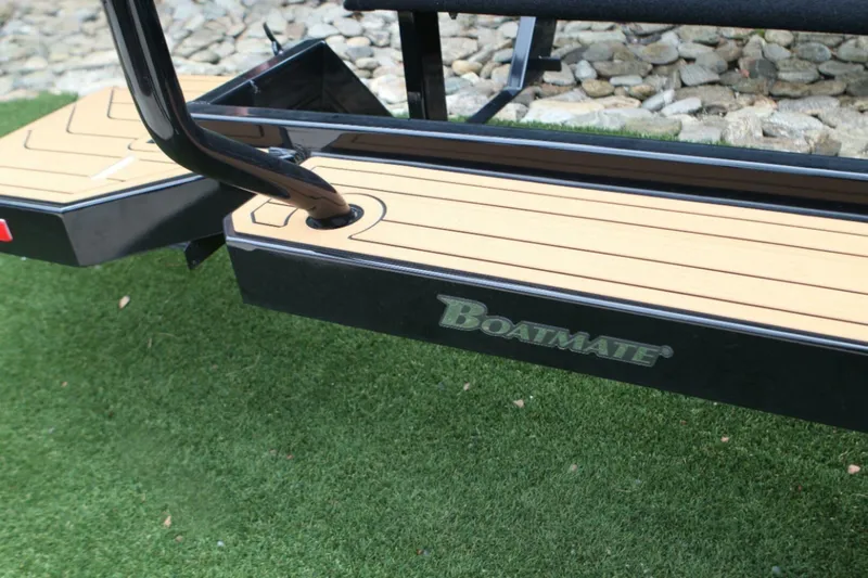  Yacht Photos Pics 2024 Nautique Super Air Nautique G23 trailer by Boatmate on grass.