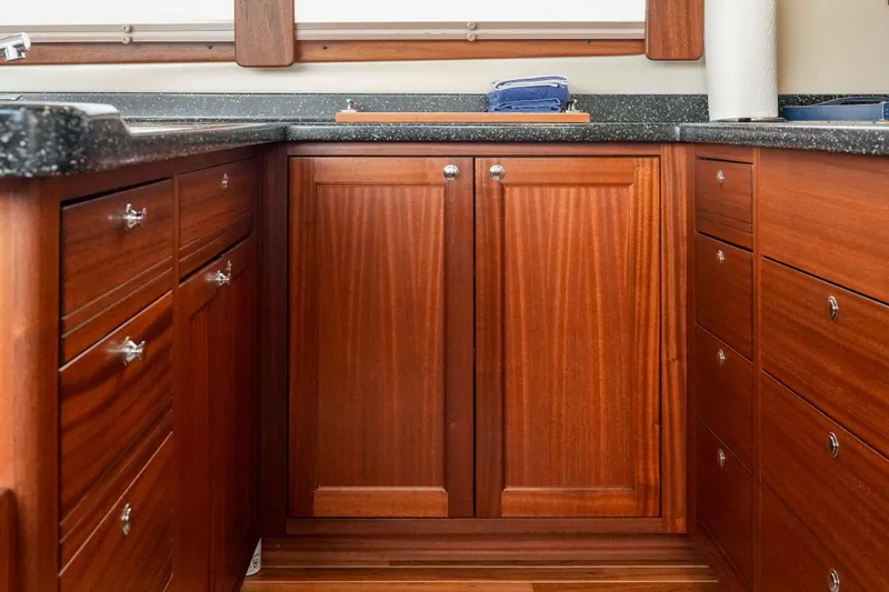 Take 2 Yacht Photos Pics Wooden cabinetry in the galley of a 2015 Nordic Tug 44 boat.
