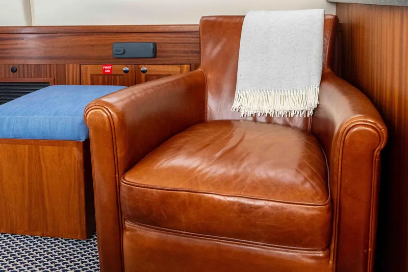 Take 2 Yacht Photos Pics Luxurious leather chair with a throw blanket in a 2015 Nordic Tug 44 interior.