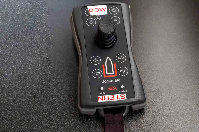 Take 2 Yacht Photos Pics Remote control for Nordic Tug 44, 2015 model, featuring joystick and directional buttons.
