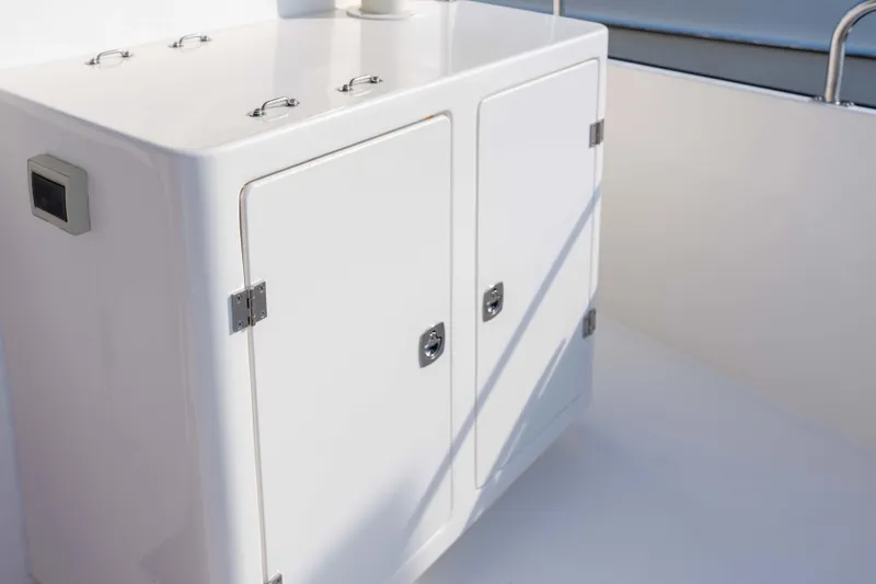 Take 2 Yacht Photos Pics White storage cabinet on 2015 Nordic Tug 44 boat deck.