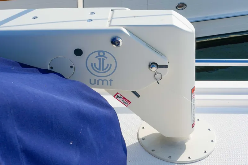 Take 2 Yacht Photos Pics Nordic Tug 44 (2015) boat detail with UMT logo and blue cover.