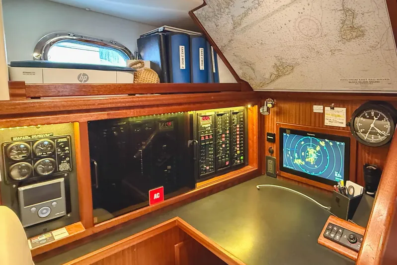 Take 2 Yacht Photos Pics Navigation station of a 2015 Nordic Tug 44 with radar and control panels.