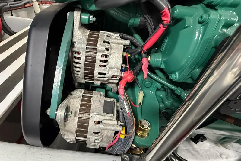 Take 2 Yacht Photos Pics Engine components of a 2015 Nordic Tug 44, featuring dual alternators and wiring.