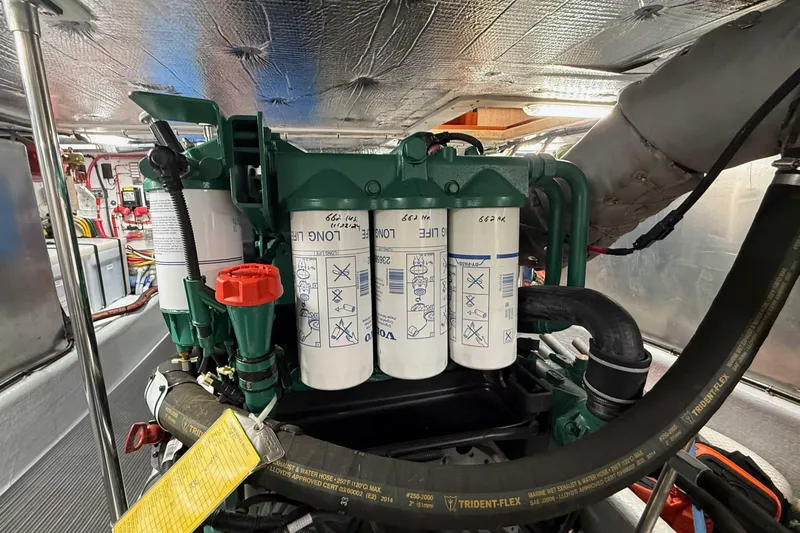 Take 2 Yacht Photos Pics Engine room of a 2015 Nordic Tug 44, featuring detailed mechanical components.