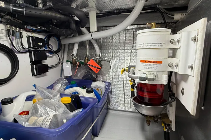 Take 2 Yacht Photos Pics Engine room of 2015 Nordic Tug 44 with fuel filter and storage containers.