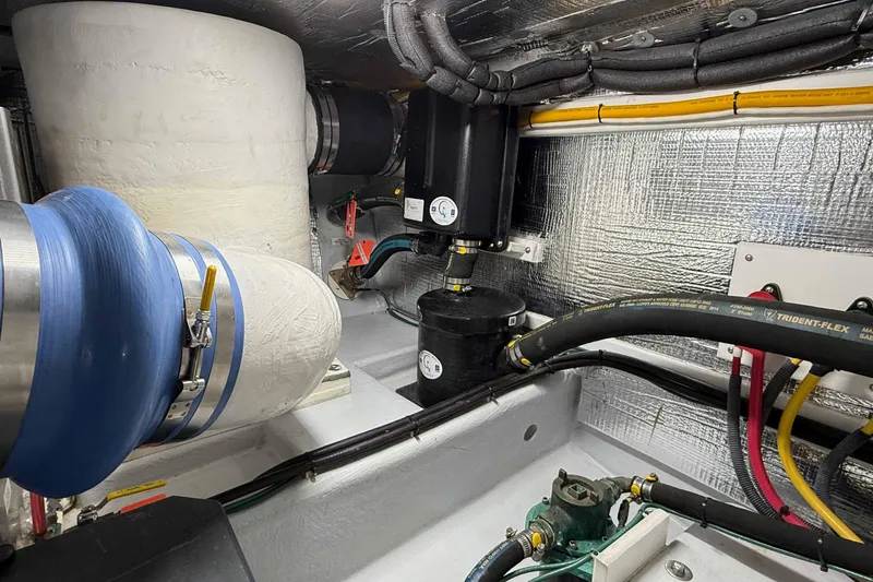 Take 2 Yacht Photos Pics Engine room of a 2015 Nordic Tug 44 with insulated pipes and wiring.
