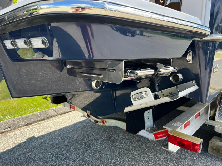  Yacht Photos Pics 2024 Ranger Tugs R-27 boat on trailer, rear view showing trim tabs and hull design.
