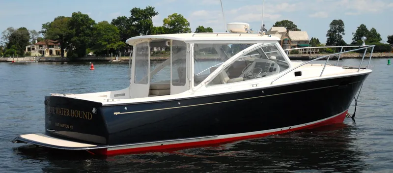 4652tw Yacht Photos Pics 2007 MJM 29z boat on calm water with scenic background.