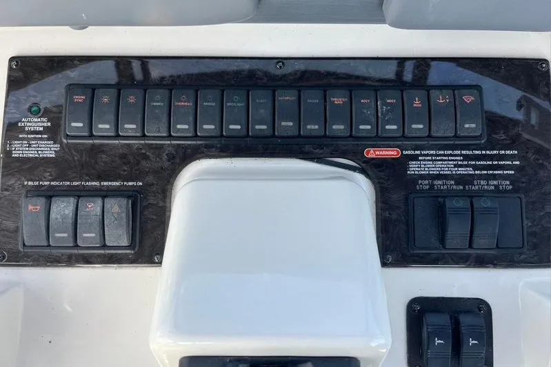 Production Office Yacht Photos Pics Control panel of a 2007 Sea Ray 36 Sedan Bridge boat with switches and buttons.