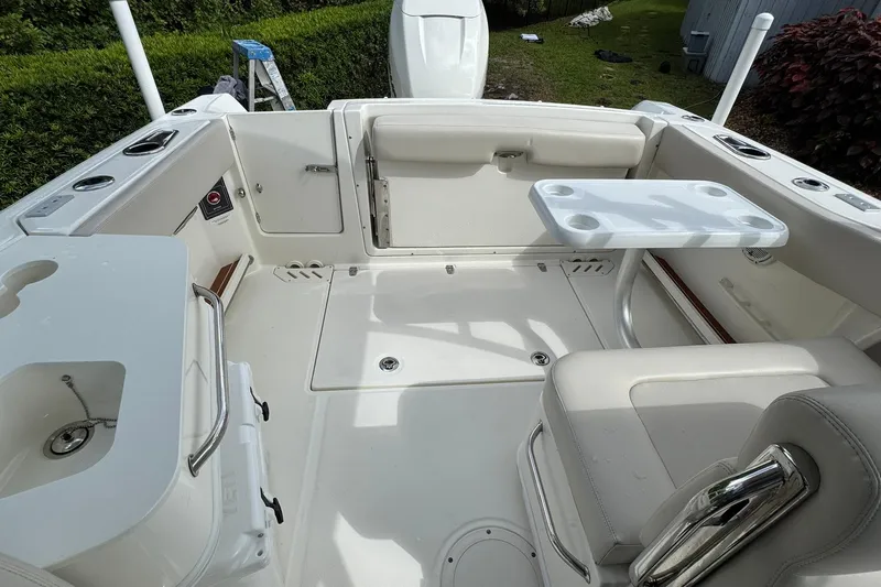  Yacht Photos Pics 2019 Boston Whaler 230 Vantage boat interior with seating and table setup.