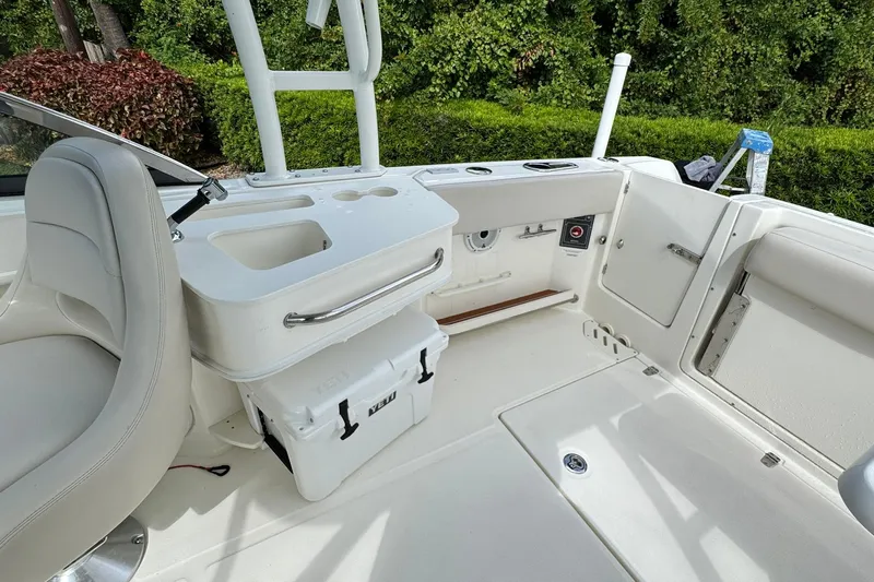  Yacht Photos Pics 2019 Boston Whaler 230 Vantage boat interior with seating and storage features.