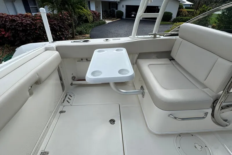  Yacht Photos Pics 2019 Boston Whaler 230 Vantage interior with seating and table setup.