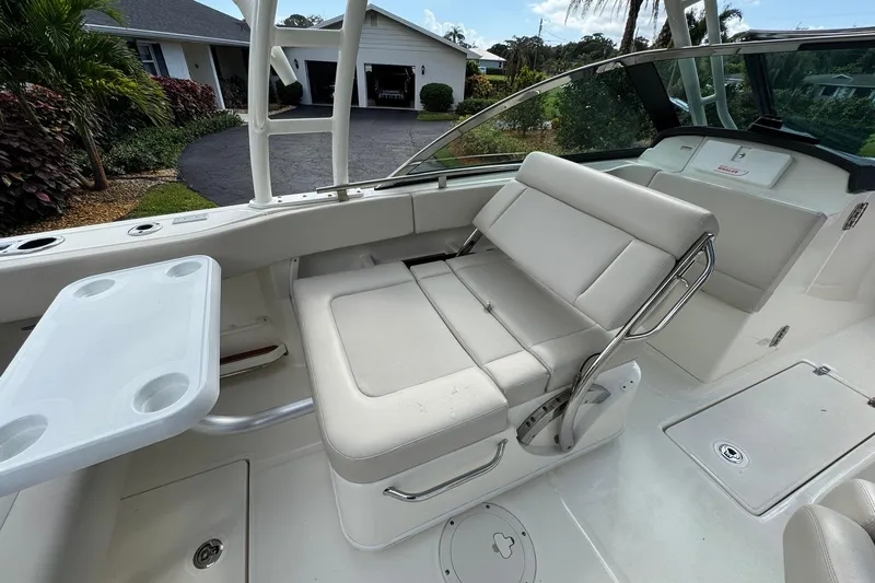  Yacht Photos Pics 2019 Boston Whaler 230 Vantage boat interior with white seating and table.