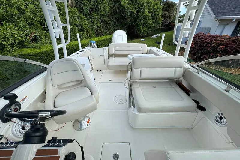  Yacht Photos Pics 2019 Boston Whaler 230 Vantage boat interior with white seating and steering wheel.
