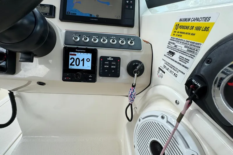  Yacht Photos Pics Control panel of a 2019 Boston Whaler 230 Vantage boat with navigation instruments.