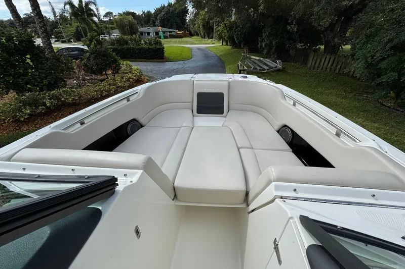  Yacht Photos Pics 2019 Boston Whaler 230 Vantage boat interior with cushioned seating and scenic background.