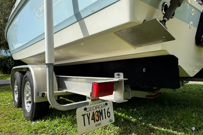  Yacht Photos Pics 2019 Boston Whaler 230 Vantage on trailer, Georgia license plate visible.
