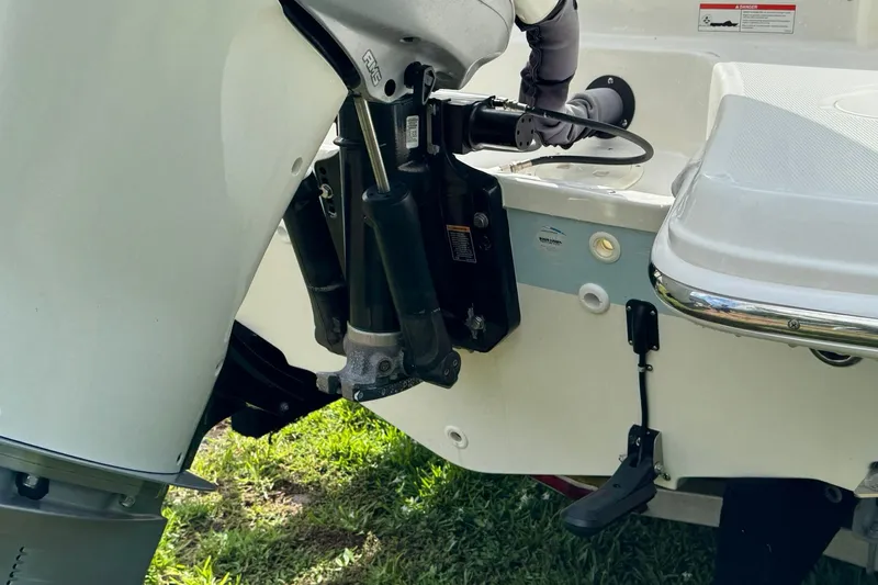  Yacht Photos Pics 2019 Boston Whaler 230 Vantage boat engine detail, showcasing motor and hydraulic components.