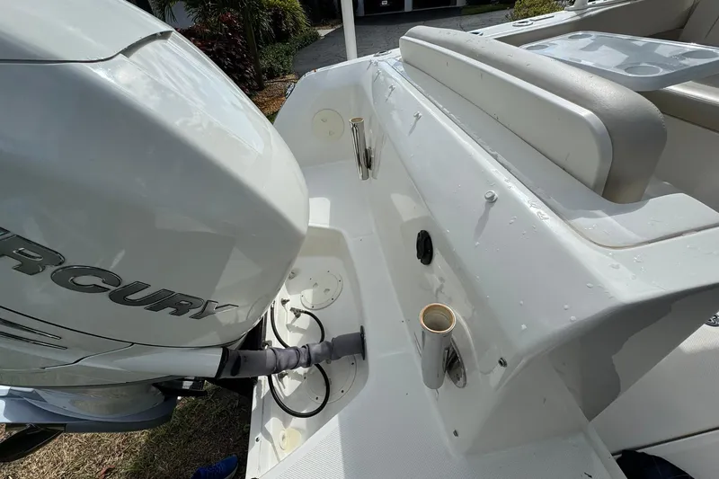  Yacht Photos Pics 2019 Boston Whaler 230 Vantage boat with Mercury engine, rear seating area.