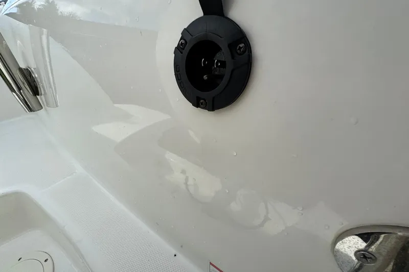  Yacht Photos Pics 2019 Boston Whaler 230 Vantage boat detail showing a black circular fixture on white surface.
