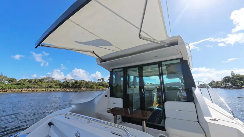  Yacht Photos Pics 2020 Tiara Yachts C53 Coupe on water, showcasing sleek design and spacious deck.