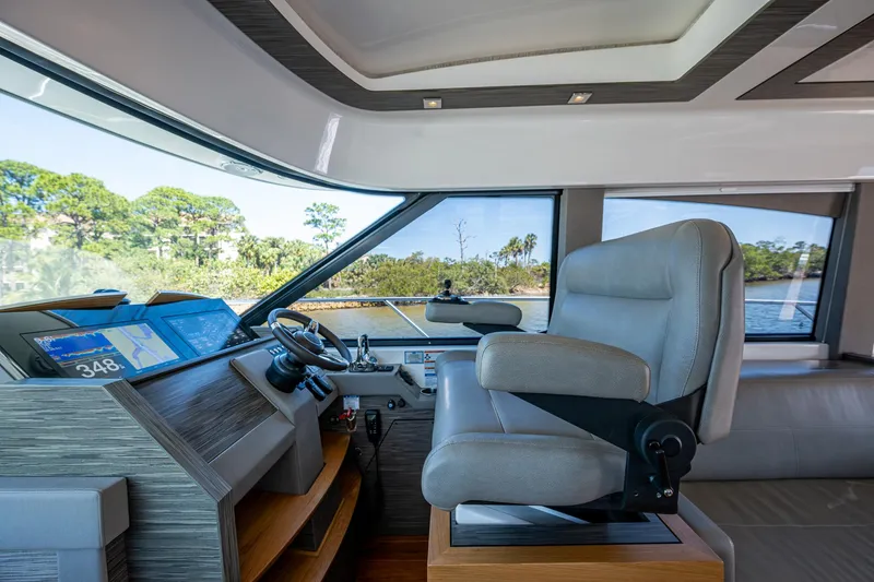  Yacht Photos Pics Interior of 2020 Tiara Yachts C53 Coupe, featuring modern helm and luxurious seating.