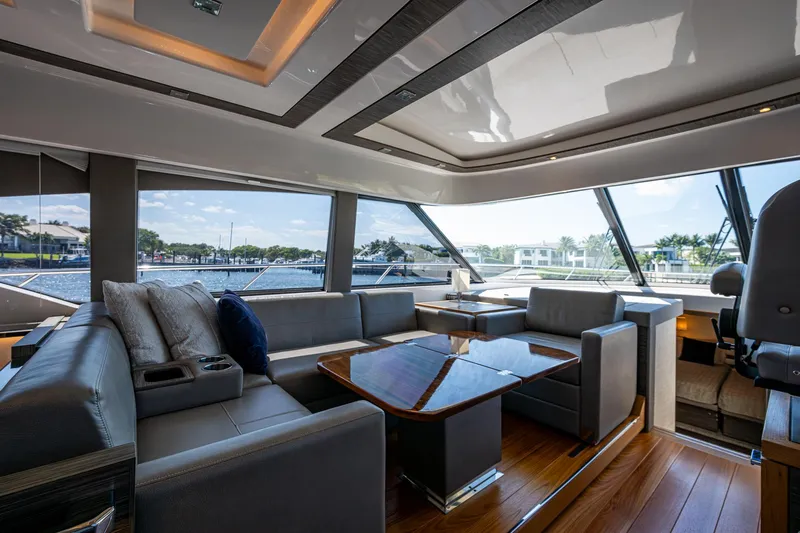  Yacht Photos Pics Luxurious interior of 2020 Tiara Yachts C53 Coupe with elegant seating and panoramic windows.