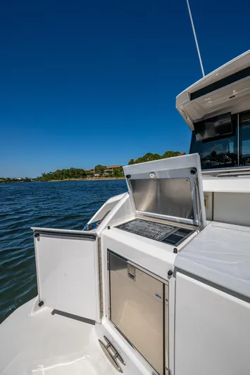  Yacht Photos Pics 2020 Tiara Yachts C53 Coupe, outdoor kitchen area, scenic water view.