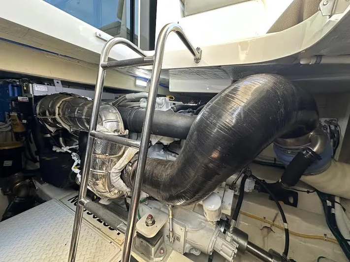  Yacht Photos Pics Engine compartment of 2020 Tiara Yachts C53 Coupe with visible ladder and exhaust system.