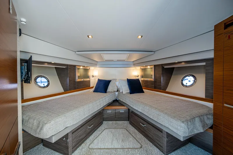  Yacht Photos Pics Luxurious 2020 Tiara Yachts C53 Coupe cabin with twin beds and modern decor.
