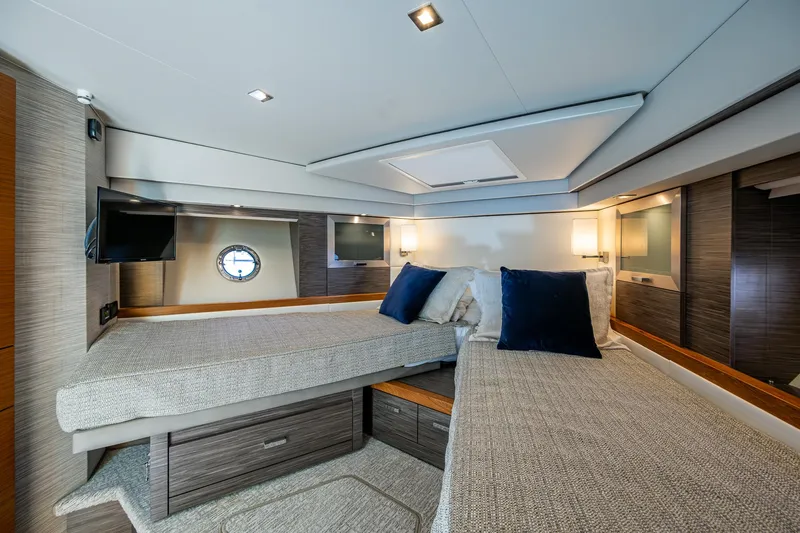  Yacht Photos Pics Luxurious interior of 2020 Tiara Yachts C53 Coupe with twin beds and modern decor.