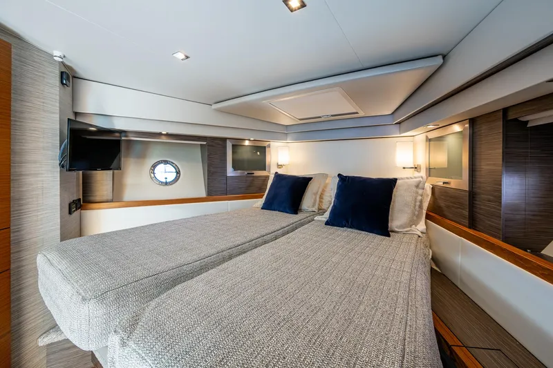  Yacht Photos Pics Luxurious 2020 Tiara Yachts C53 Coupe cabin with twin beds and modern decor.