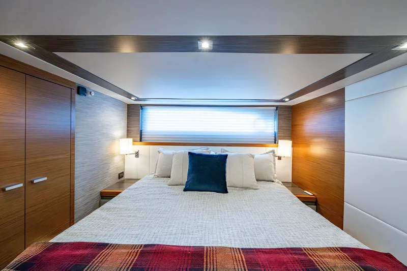  Yacht Photos Pics Luxurious bedroom interior of 2020 Tiara Yachts C53 Coupe with modern design and cozy bedding.
