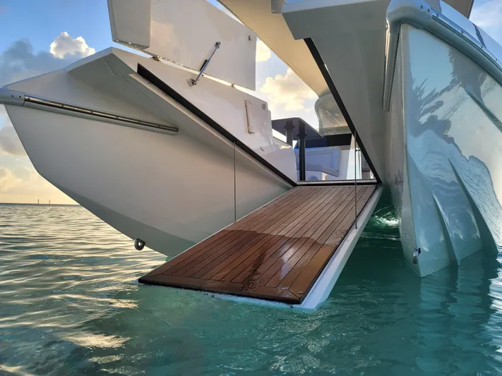 Cat40 Yacht Photos Pics 2022 Catamaran PRJ Cat40 with open deck ramp on tranquil water.