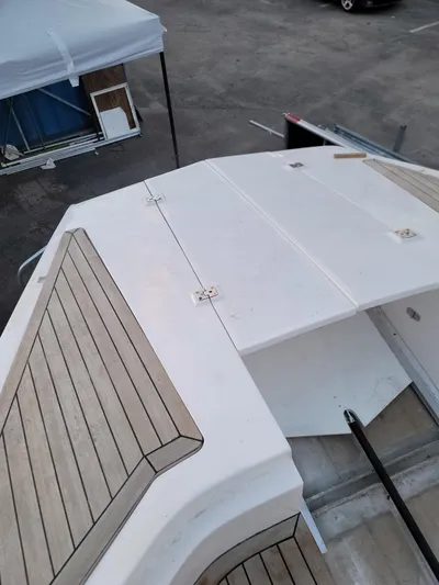 Cat40 Yacht Photos Pics 2022 Catamaran PRJ Cat40 deck with wood accents, viewed from above.