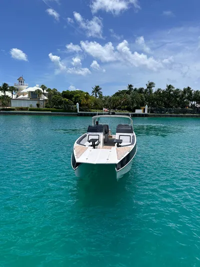 Cat40 Yacht Photos Pics 2022 Catamaran PRJ Cat40 on turquoise water, clear sky, lush background.