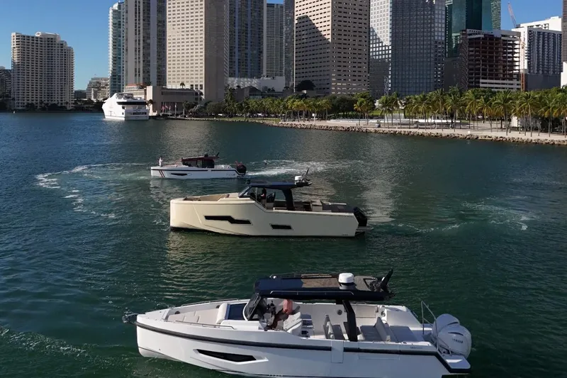  Yacht Photos Pics Modern Fabbro F33 boats cruising in a city harbor, 2026 model.