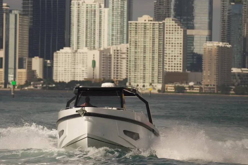  Yacht Photos Pics Fabbro F33 boat cruising near city skyline, 2026 model.