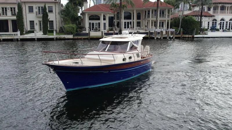 Fratelli Aprea Sorrento 32 Yacht Photos Pics 2023 Fratelli Aprea Sorrento Cabinatto 32 yacht cruising near luxury waterfront homes.