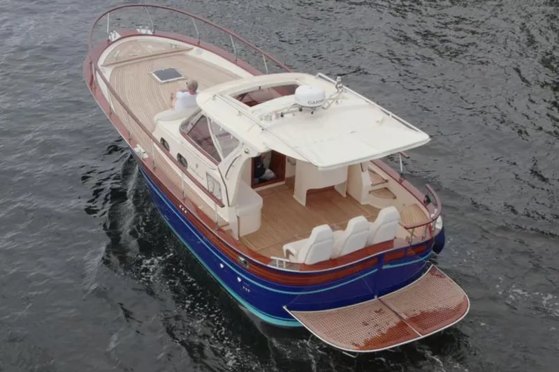 Fratelli Aprea Sorrento 32 Yacht Photos Pics 2023 Fratelli Aprea Sorrento Cabinatto 32 luxury boat cruising on water.