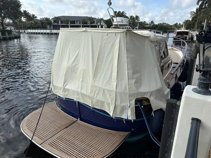 Fratelli Aprea Sorrento 32 Yacht Photos Pics 2023 Fratelli Aprea Sorrento Cabinatto 32 docked with cover, rear view.