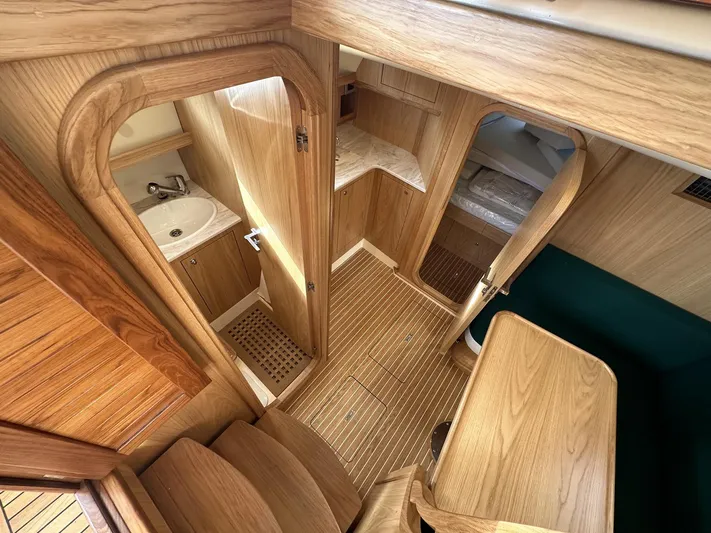 Fratelli Aprea Sorrento 32 Yacht Photos Pics Interior of 2023 Fratelli Aprea Sorrento Cabinatto 32, featuring wooden finishes and compact design.