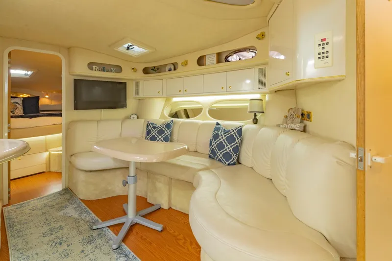 Just The Two Of Us Yacht Photos Pics Luxurious interior of 1997 Sea Ray 400 Sundancer yacht with plush seating and modern amenities.