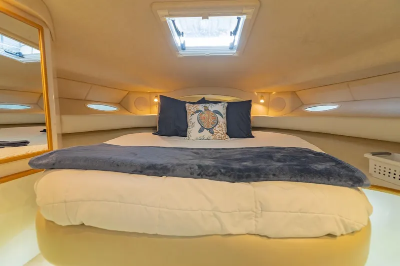 Just The Two Of Us Yacht Photos Pics Luxurious cabin interior of 1997 Sea Ray 400 Sundancer yacht with cozy bedding.