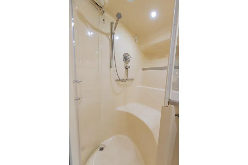 Just The Two Of Us Yacht Photos Pics Shower area in 1997 Sea Ray 400 Sundancer yacht, featuring modern fixtures and lighting.