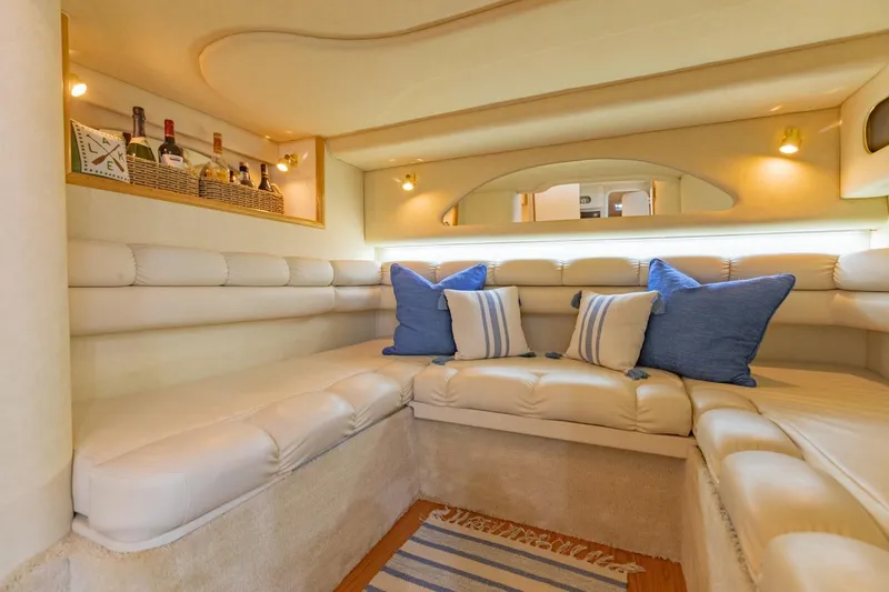 Just The Two Of Us Yacht Photos Pics Luxurious interior of 1997 Sea Ray 400 Sundancer yacht with plush seating and decorative pillows.