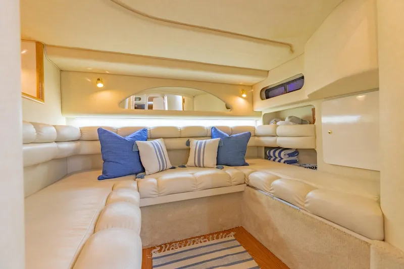 Just The Two Of Us Yacht Photos Pics Luxurious interior of 1997 Sea Ray 400 Sundancer yacht with plush seating and nautical decor.