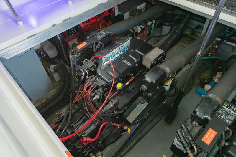 Just The Two Of Us Yacht Photos Pics Engine compartment of a 1997 Sea Ray 400 Sundancer boat, showcasing mechanical components.